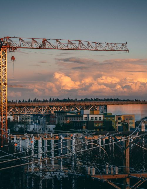 beautiful-view-construction-site-city-during-sunset-min